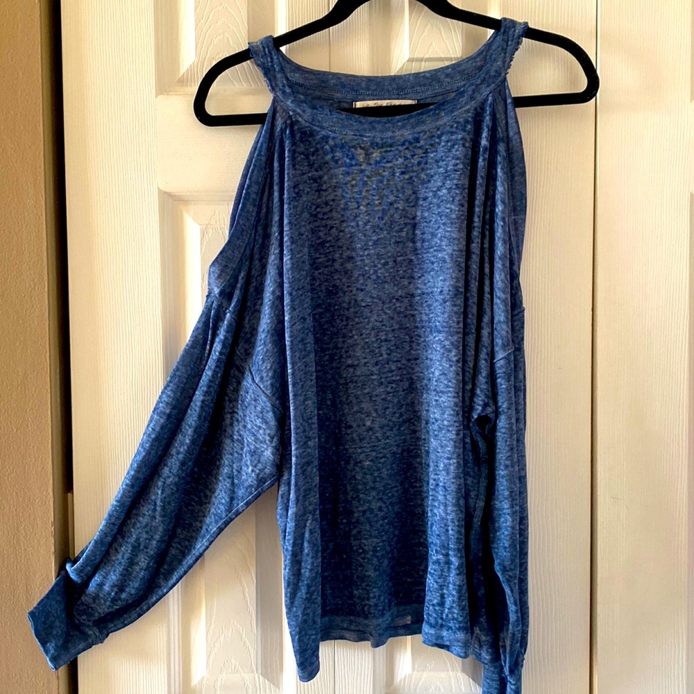 Free People’s in-house line “We the Free” blouse with off the shoulder sleeves.